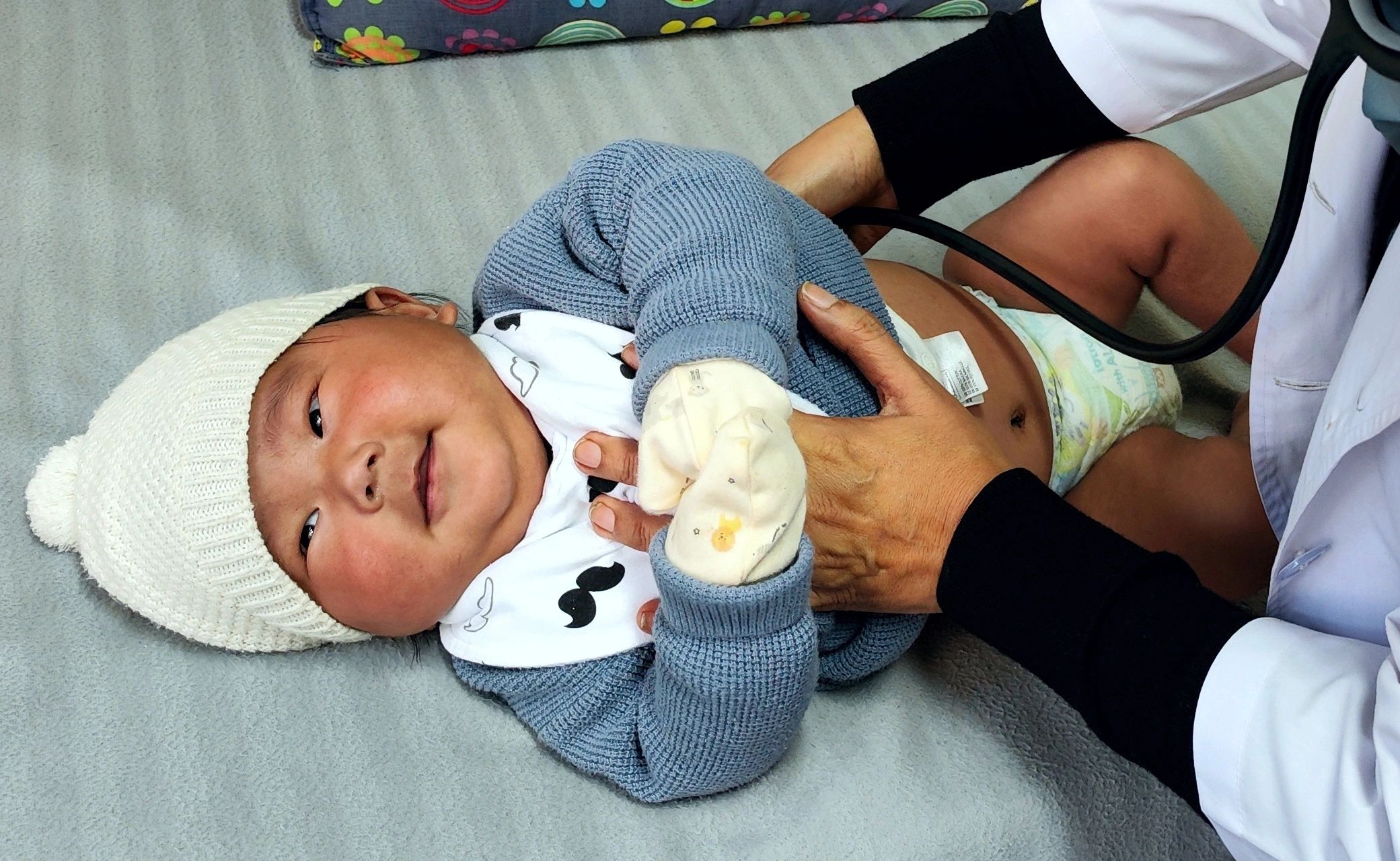 Dr. Anu with a baby