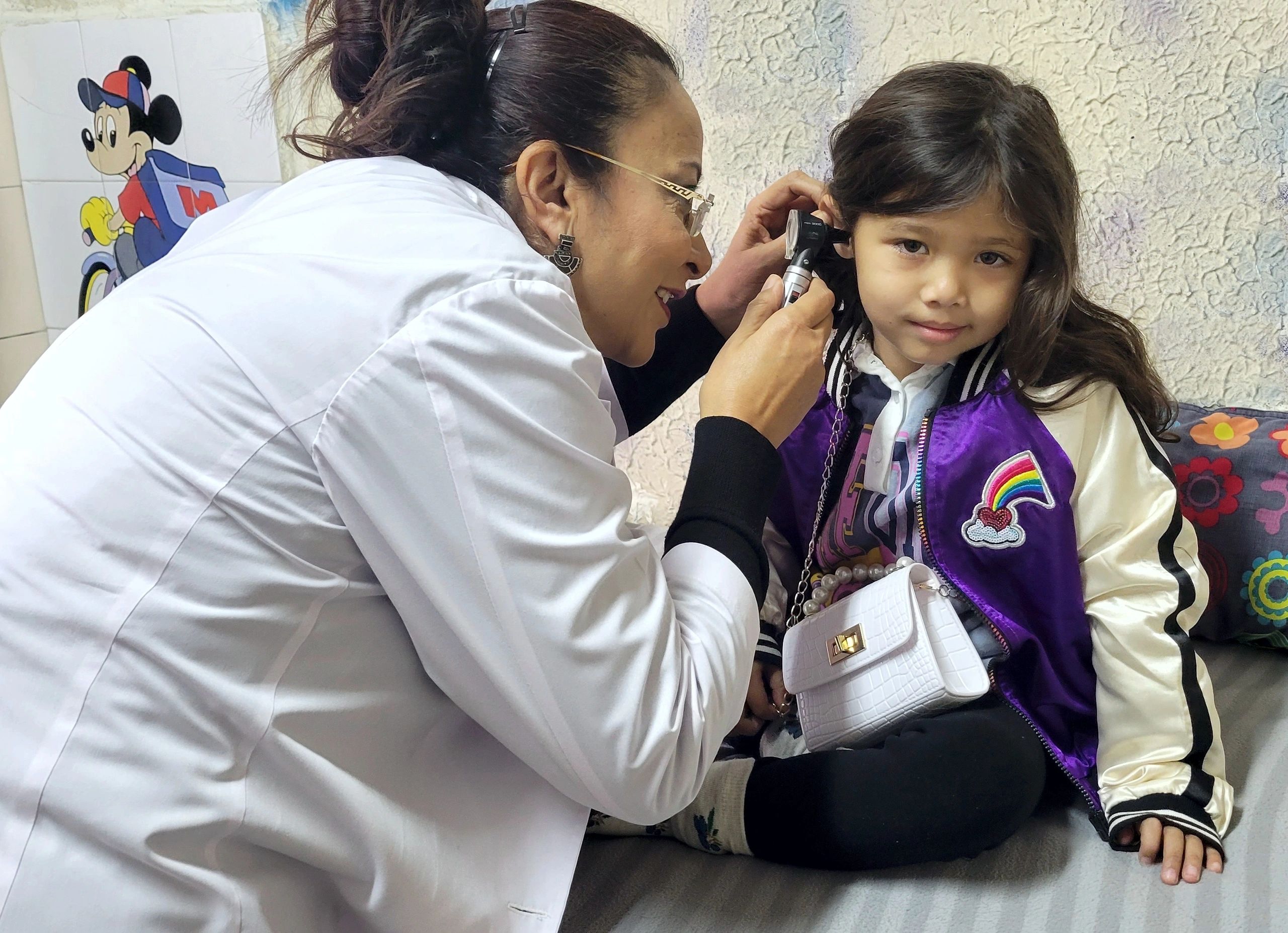 Kopila doctor examining a child